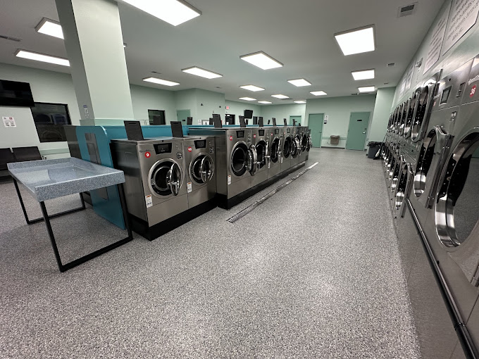 Wide view of washers and dryers inside The Bubble Hut North Jefferson in Athens, Alabama